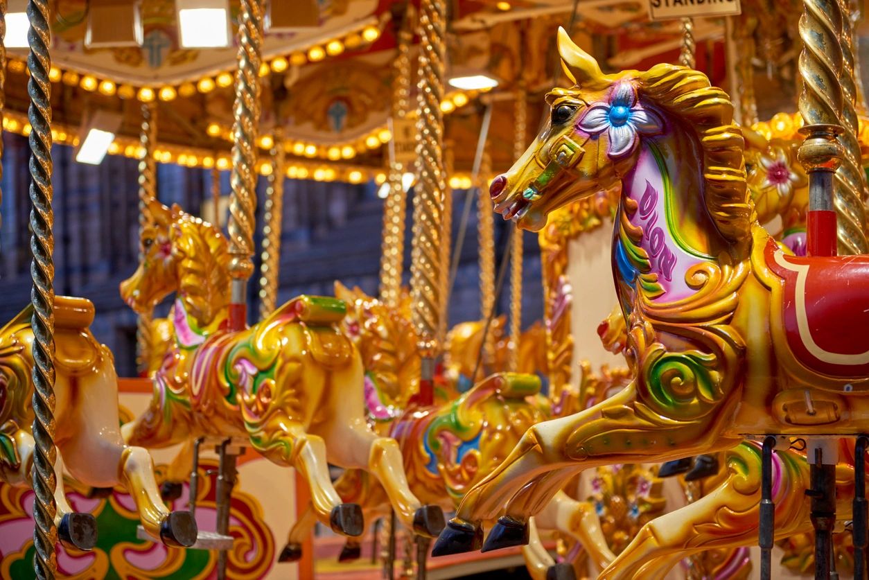 Walt Disney World and Disneyland Vacations Colorful carousel ride at a family theme park