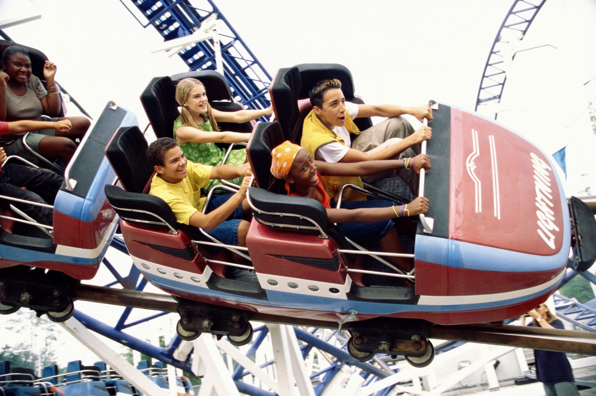 Universal Orlando and Hollywood Vacations Family enjoying a roller coaster during a theme park vacation